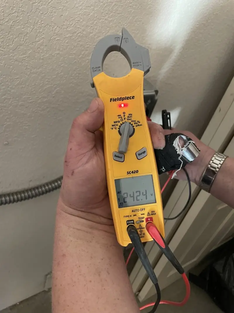 Voltage testing with clamp meter during Electrical Installation Services in East Amwell